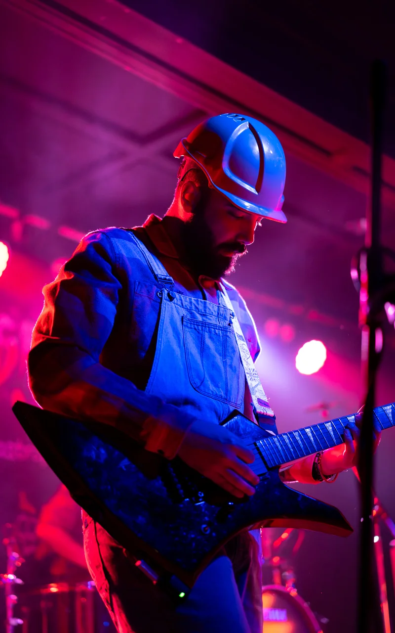 guitar player dressed as construction worker photograph